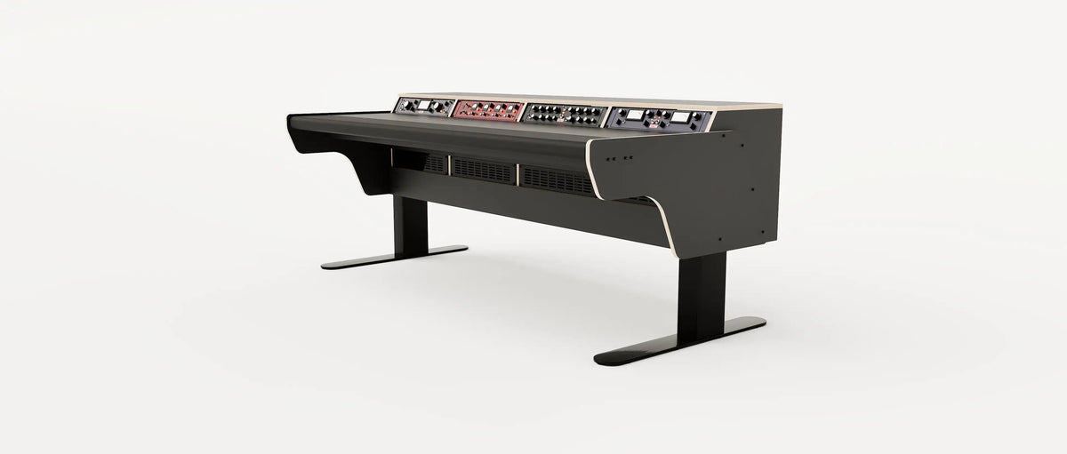 Wide angle view of the Binary premium studio desk with padded arm rest and 4x 2 rack units on the desktop. Integrated cable management and powder coated steel legs. Black with expressed plywood edge.