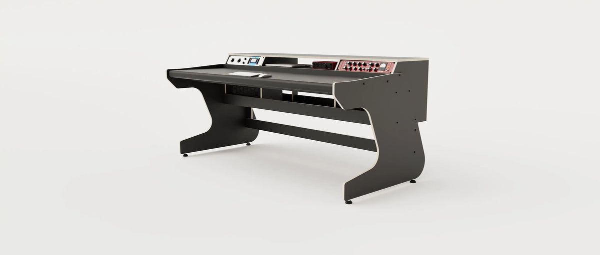 Wide angle view of the Callisto 1922 studio desk with padded arm rest and 2x 2 rack units on the desktop. Integrated cable management. Black with expressed  plywood edge.