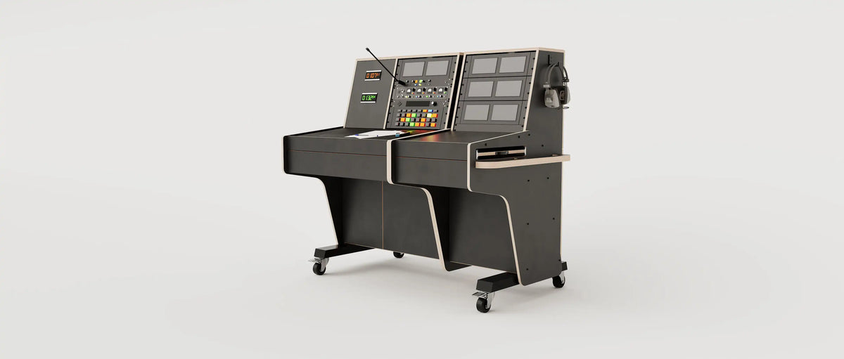Wide angle view of the custom Stage Management Console model 31A with 20 rack units above the worktop, triple door cabinet, 2x Large drawers, steel legs with 80mm wheels. Black with expressed plywood edge.